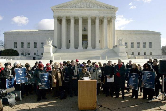 Norma McCorvey (C-Podium), the Roe of Roe v. Wade, speaks on the steps of the US Supreme Court on January 18, 2005 after petitioning the court to reverse its landmark decision that granted women the right to an abortion