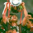 (FILES) Patrick Kluivert lifts the trophy after scoring the winner for Ajax against AC Milan in the 1995 Champions League final