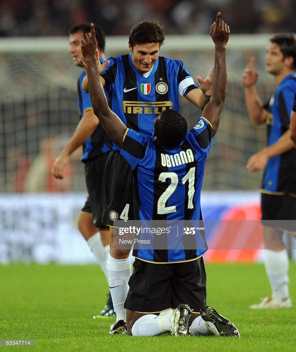 Obinna Nsofor and Luis Figo (New Press/Getty Images)
