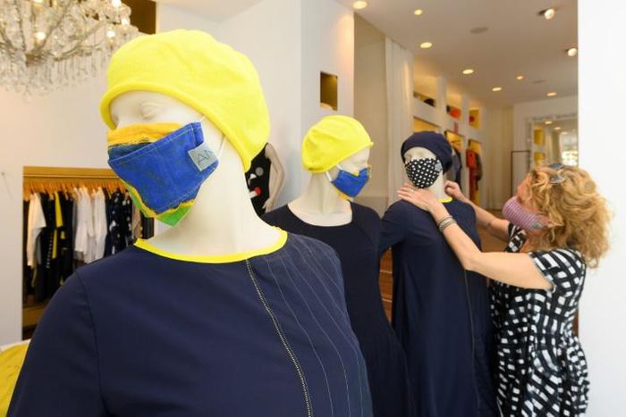 Some small shops in Germany began to reopen Monday after a weeks-long national lockdown