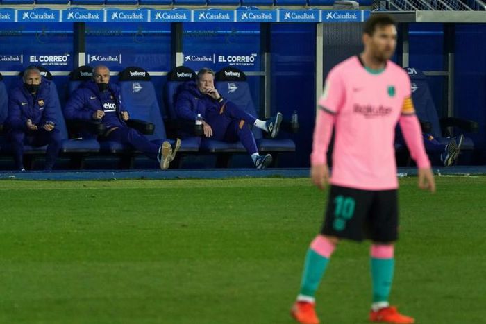 Koeman (seated, right) denies Messi is difficult to manage