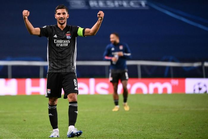 Houssem Aouar celebrates at the end of Lyon's Champions League quarter-final victory over Manchester City in Lisbon
