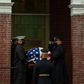 Military pallbearers on July 25, 2020 carry the body of civil rights leader John Lewis into a Selma, Alabama church; a day later his casket was escorted in a final solemn procession across the Selma bridge where he was beaten during a 1965 protest