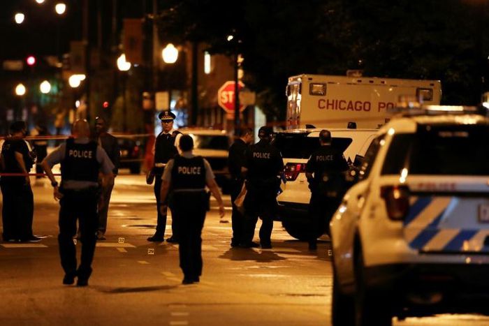 Fourteen people were wounded in the shootout outside a funeral parlor in Chicago