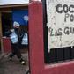 A volunteer at the "Women Warriors" soup kitchen helps feed some of Chile's neediest