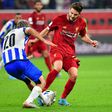 Liverpool midfielder Adam Lallana (R) has agreed a new short-term contract for the rest of this season