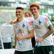 Bremen players Milot Rashica (L) and Joshua Sargent celebrate after Saturday's league win put them into the Bundesliga's relegation/promotion play-off against Heidenheim.