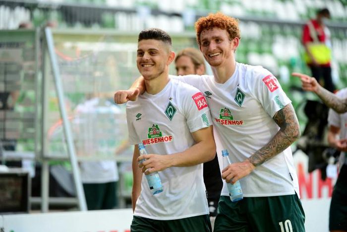 Bremen players Milot Rashica (L) and Joshua Sargent celebrate after Saturday's league win put them into the Bundesliga's relegation/promotion play-off against Heidenheim.