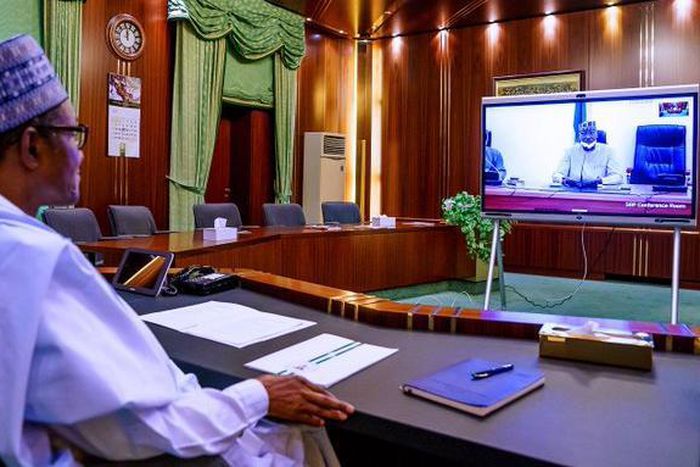 President Muhammadu Buhari receiving updates from the Presidential Task Force on Coronavirus va teleconferencing. [Twitter/@BashirAhmaad]