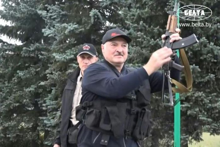 IMAGESBelarus state agency "Belta" releases images of President Alexander Lukashenko holding an automatic rifle and wearing body armour as he arrives, on Sunday evening, at his residence in Minsk, not far from where opposition protests are taking place...