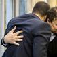 Iranian doctor Majid Taheri, who had been detained in the United States for 16 months, hugs his children upon his arrival at Tehran's Imam Khomeini International Airport on Monday