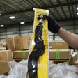 A US Customs and Border Protection officer at the Port of New York/Newark inspects a shipment of hair pieces and accessories from China suspected to have been made with forced or prison labor
