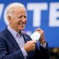 Democratic presidential nominee Joe Biden takes off his face mask to speak during a drive-in campaign rally at Bucks County Community College on October 24, 2020 in Bristol, Pennsylvania.