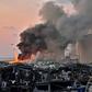A helicopter pours water onto the fire at the port of Lebanon's capital Beirut