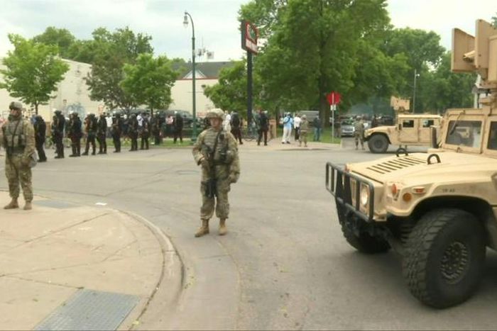 IMAGES National Guard soldiers are deployed in Minneapolis for peacekeeping after a third night of rioting over police brutality against African Americans left hundreds of shops damaged and a police station on fire.