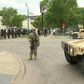IMAGES National Guard soldiers are deployed in Minneapolis for peacekeeping after a third night of rioting over police brutality against African Americans left hundreds of shops damaged and a police station on fire.