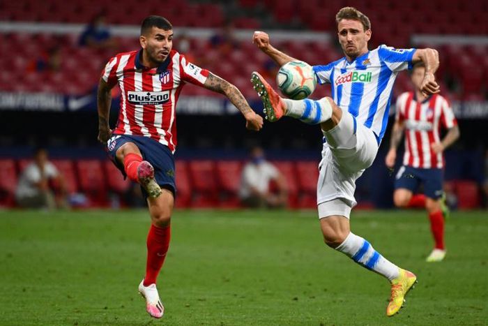 Atletico Madrid named Argentinian forward Angel Correa (L) as one of two players who had tested positive for coronavirus