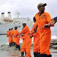 Workers at the Kenyan port of Mombasa haul ashore a fibre optic cable in June 2009 as part of a scheme to boost internet connectivity in East Africa