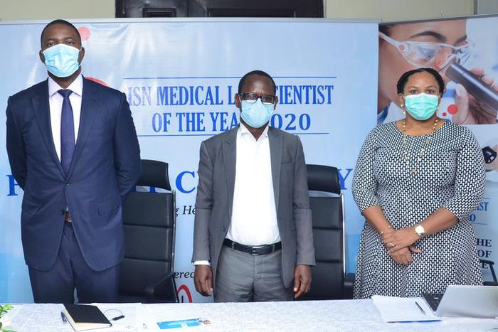 L- R, The Project Consultant, ISN Medical Laboratory Scientist of the Year Award, Mr. Daniel Adewuni; the Executive Director,ISN Products Nigeria Limited, Mr. Felix Ofungwu, the immediate Past President, Association of Medical Laboratory Scientist of N...