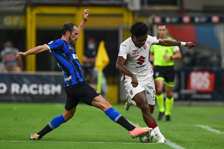 Torino's Nigerian defender Ola Aina (R) has joined Fulham
