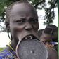 Why girls of the Mursi tribe must remove their teeth and stretch their lips before they marry