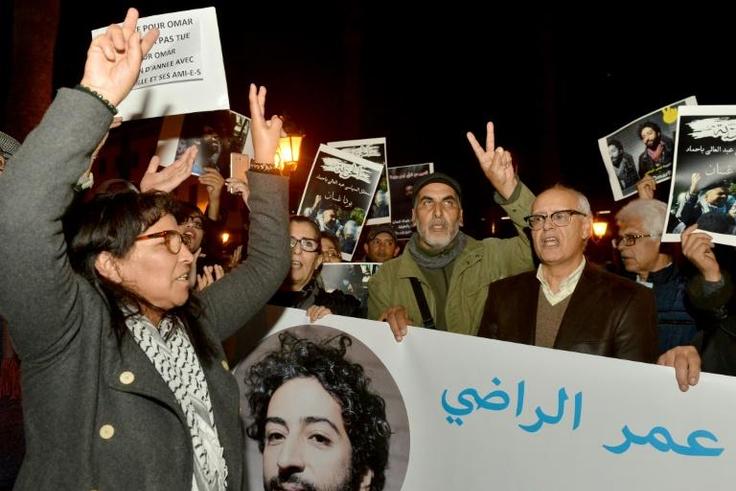Demonstrators shout slogans in support of Omar Radi (pictured on the banner), a Moroccan journalist detained over tweet criticising judge, during a demonstration, on December 28, 2019, in the city of Rabat