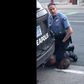 A Minneapolis police officer holds his knee to the neck of George Floyd, who died in police custody.