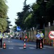 Police stand guard on a road leading to the US consulate in Chengdu, southwestern China's Sichuan province