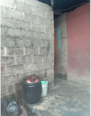 Mrs Ajala lives in an uncompleted building with her three children (Pulse)