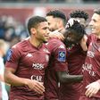 Senegalese Ibrahima Niane (C) celebrates one of his goals for Metz in a Ligue 1 hat-trick against Lorient.