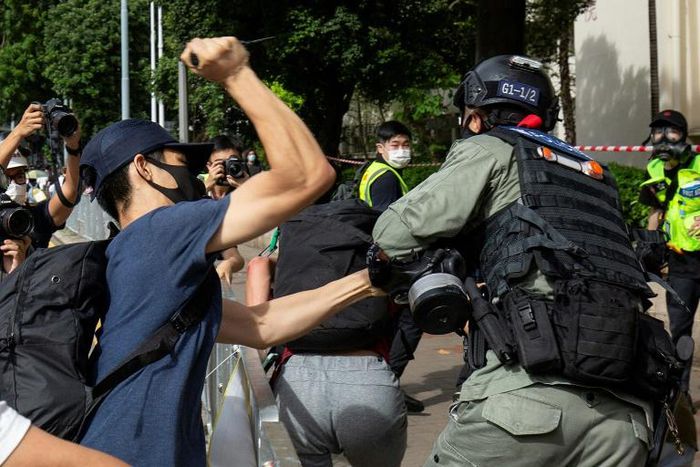 A man has been arrested on suspcion of stabbing a police officer during protests