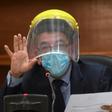 Judge Miguel Angel Galvez wears a face shield and a mask during a hearing against Guatemalan ex-president Otto Perez in Guatemala City on May 12, 2020