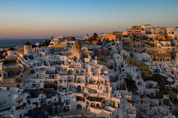 Sunset in the town of Oia on the island of Santorini as Greece prepares for the return of tourists
