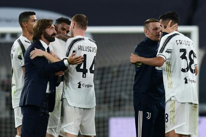 Andrea Pirlo (L) congratulates Dejan Kulusevski who scored Juventus's first goal of the season.