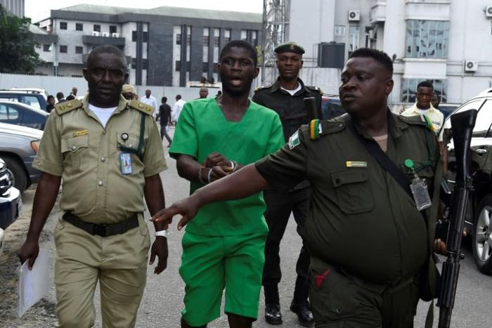 Suspected serial killer Gracious David-West, centre, being led into court on November 18