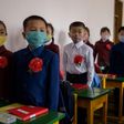 North Korean children wearing face masks against COVID-19 attend class on June 3, 2020 in Pyongyang, where Kim Jong-Un has praised the country's response to the virus