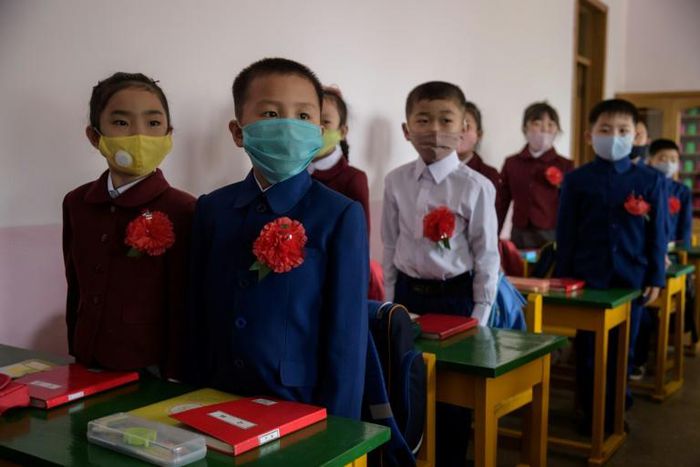North Korean children wearing face masks against COVID-19 attend class on June 3, 2020 in Pyongyang, where Kim Jong-Un has praised the country's response to the virus