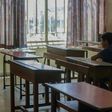 A Lebanese pupil looks out of the window of his empty classroom at Our Lady of Lourdes school, a century-old establishment in the city of Zahle that is due to close because of Lebanon's worst economic crisis sine the 1975-1990 civil war