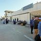 Passengers wait to depart Libya's Mitiga International Airport in Tripoli as flights resume
