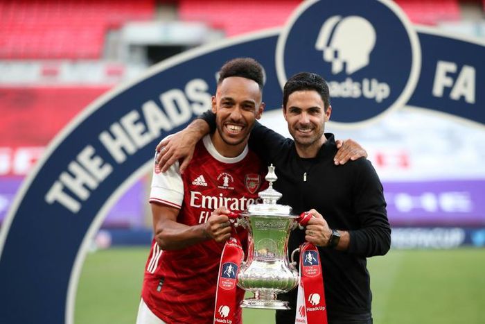 Mikel Arteta (right) is confident Pierre-Emerick Aubameyang (left) will remain at Arsenal