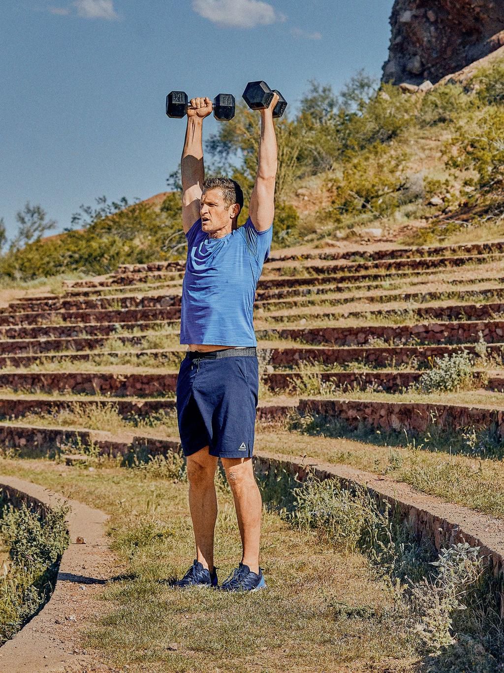 step 2 of man doing a half kneeling reverse lunge from sling subsystems