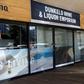 A woman walks past a closed liquor shop in Johannesburg in July 2020