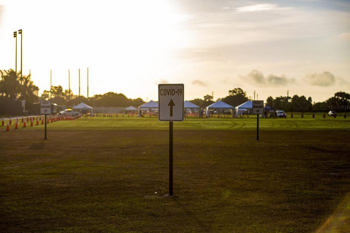 Florida's Leader Relents and Imposes Limits, Coaxed by Trump and Grim Forecast
