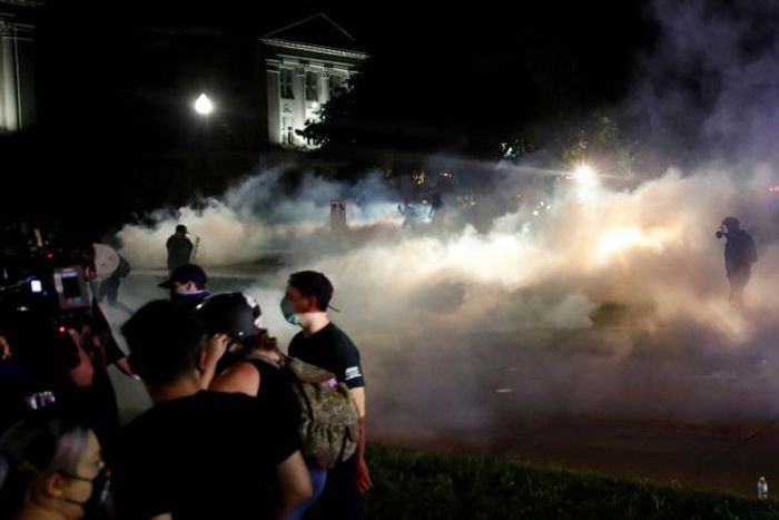 The violence occured as hundreds of protesters marched for a third night following the Jacob Blake