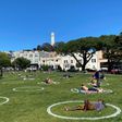 People practice social distancing at Washington square park in San Francisco