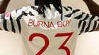 Burna Boy pays tribute to Michael Jordan in new Man United Jersey. (Twitter/BurnaBoy)