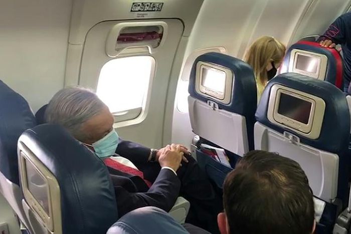 Mexican President Andres Manuel Lopez Obrador wore a face mask on the plane as he traveled to Washington to meet US President Donald Trump