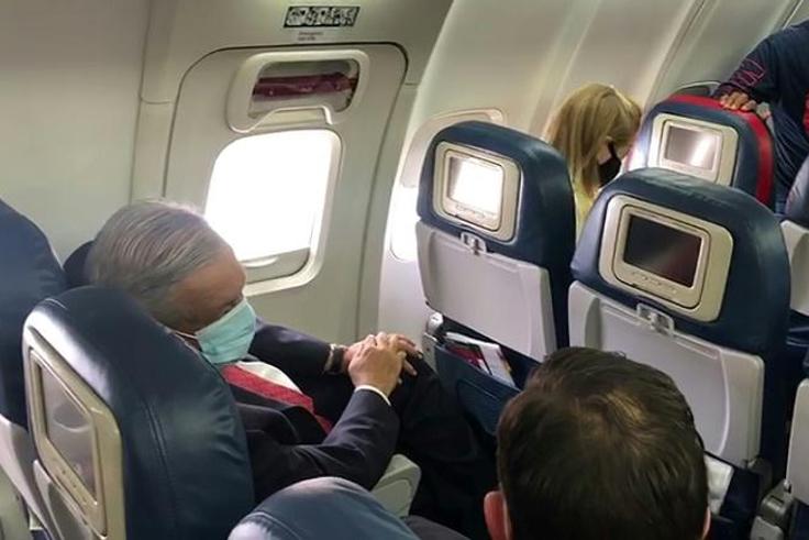Mexican President Andres Manuel Lopez Obrador wore a face mask on the plane as he traveled to Washington to meet US President Donald Trump