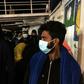 Police escorted the migrants a short distance to another ship, where they will be quarantined to prevent the possible spread of coronavirus