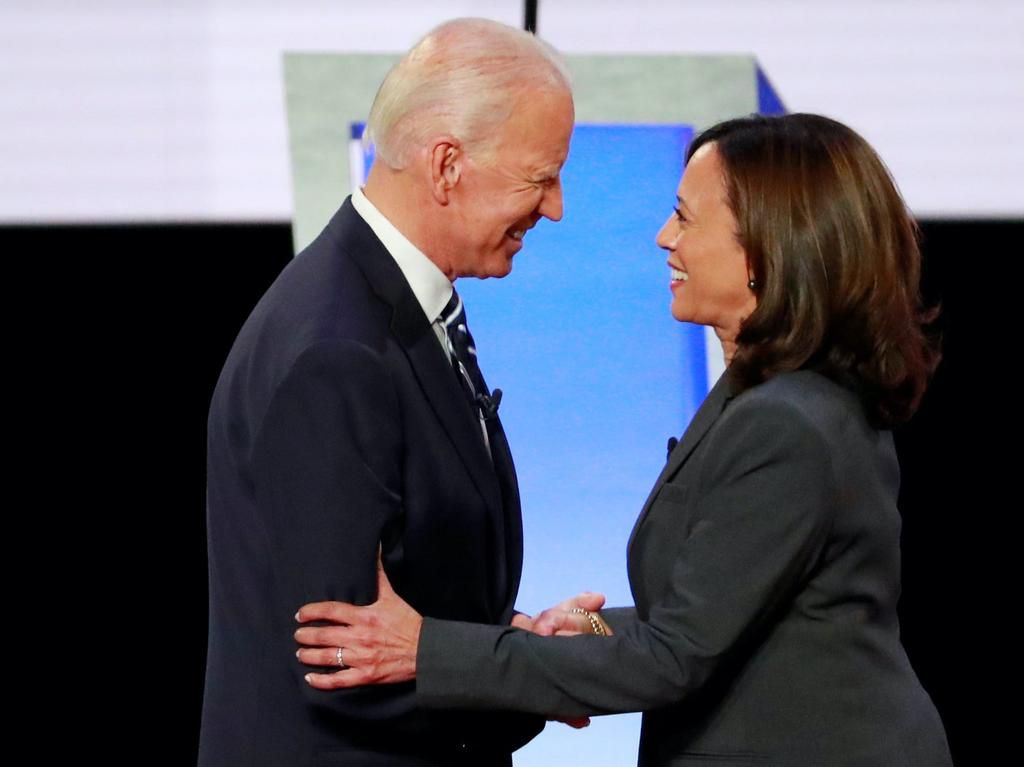 Former Vice President Joe Biden and Sen. Kamala Harris shake hands before the start of the second night of the second 2020 presidential Democratic candidates debate in Detroit, Michigan, July 31, 2019.